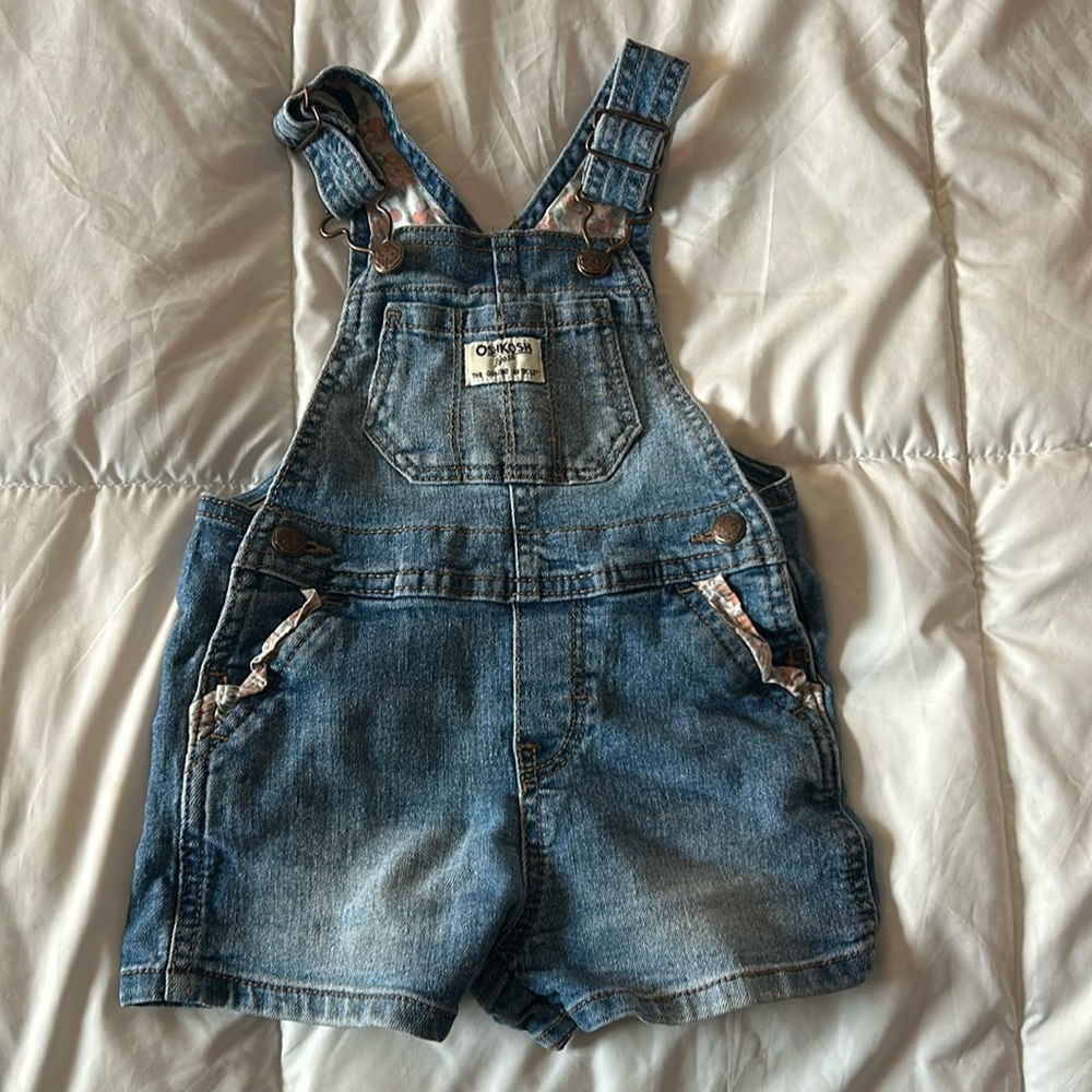Oshkosh baby overalls with some floral details on the inside